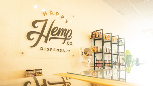 Image of happy hemp co shelves, displaying thca flower and delta 9 edibles