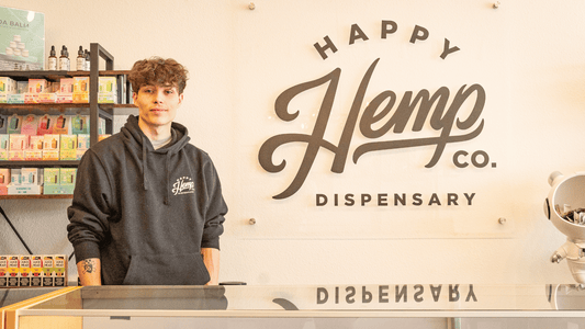 Image of happy hemp co team member, ready to give pickup order